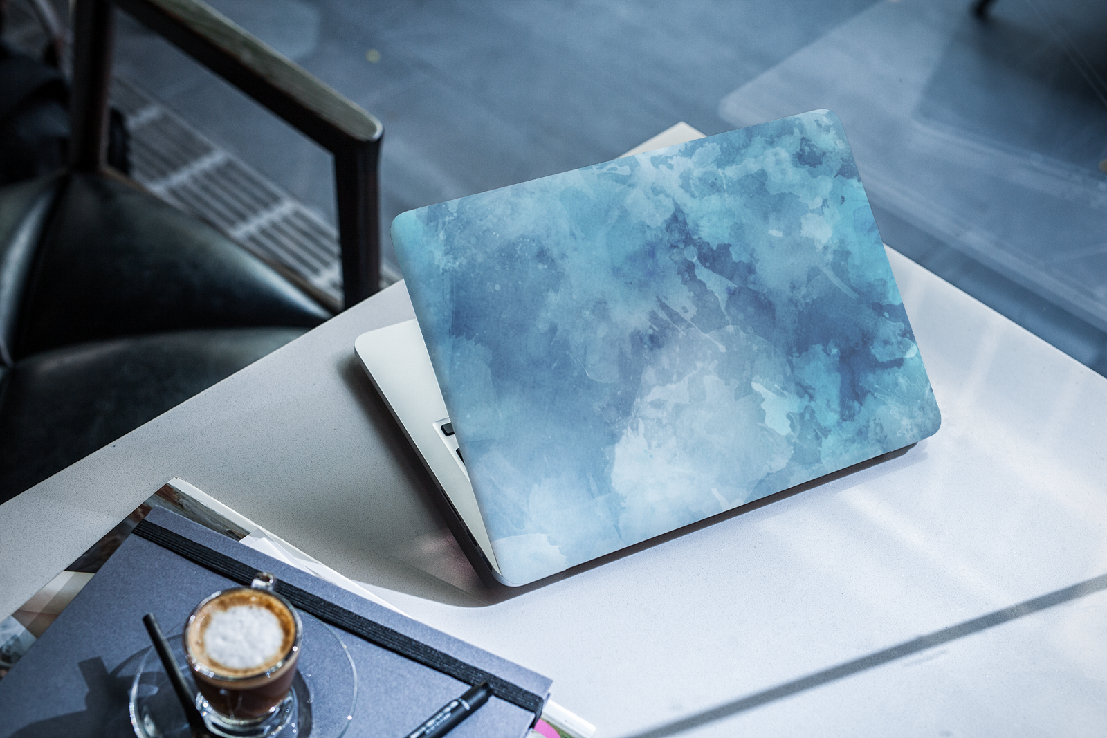 laptop-cover-mockup-of-a-computer-placed-next-to-an-espresso-2288-el1